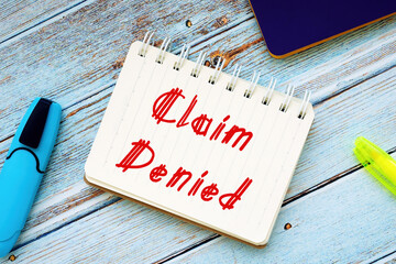 Business concept about Claim Denied with inscription on the sheet.