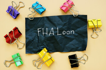Financial concept meaning FHA Loan with phrase on the sheet.