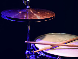 Fototapeta na wymiar Close up shot of drumsticks lie on a snare drum.