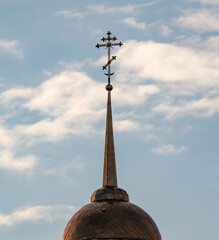 Orthodox cross on the temple against the background of the sky