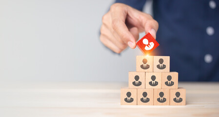 Concept of human resource management and recruitment business Hand put wood cube block on top...