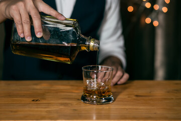 bartender pouring cocktail