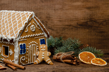 Gingerbread house and man on a wooden rustic