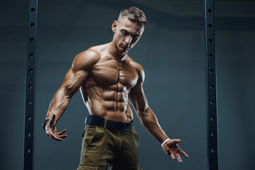 Fototapeta na wymiar Fitness athletic man workout muscles exercise