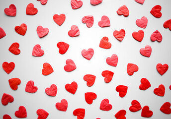 bright red hearts confetti on white background