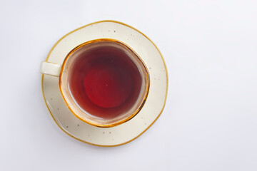 Cup with green tea over white background. Hot tea for cold weather.