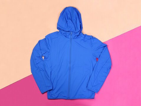 Blue hood wind jacket on passtel background