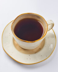 Cup with green tea over white background. Hot tea for cold weather.