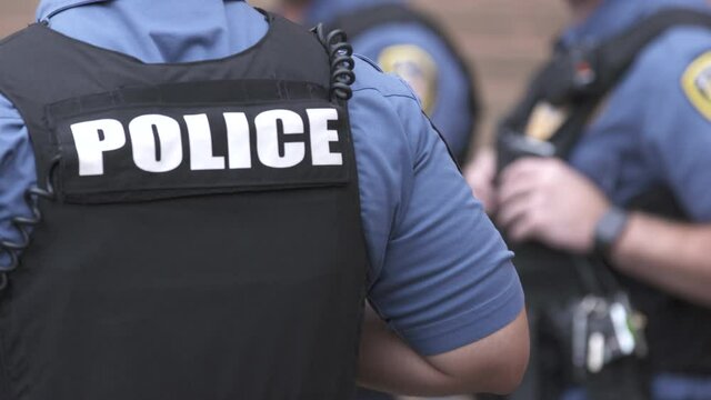 Police Officers at Meeting Outside OTS 4K