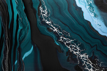 Acrylic Fluid Art. Dark green waves in abstract ocean and golden foam. Marble effect background or...