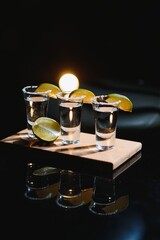 tequila with lime on a dark background
