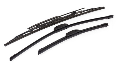 Pair of frameless windshield wipers blades against used traditional wiper