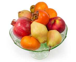 Different fruits in vintage glass bowl on a white background