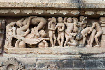 Fototapeta na wymiar Kamasutra sculpture, Khajuraho, Madhya Pradesh, India
