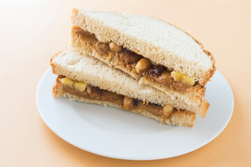 Peanut butter with bread and raspberry marmalade