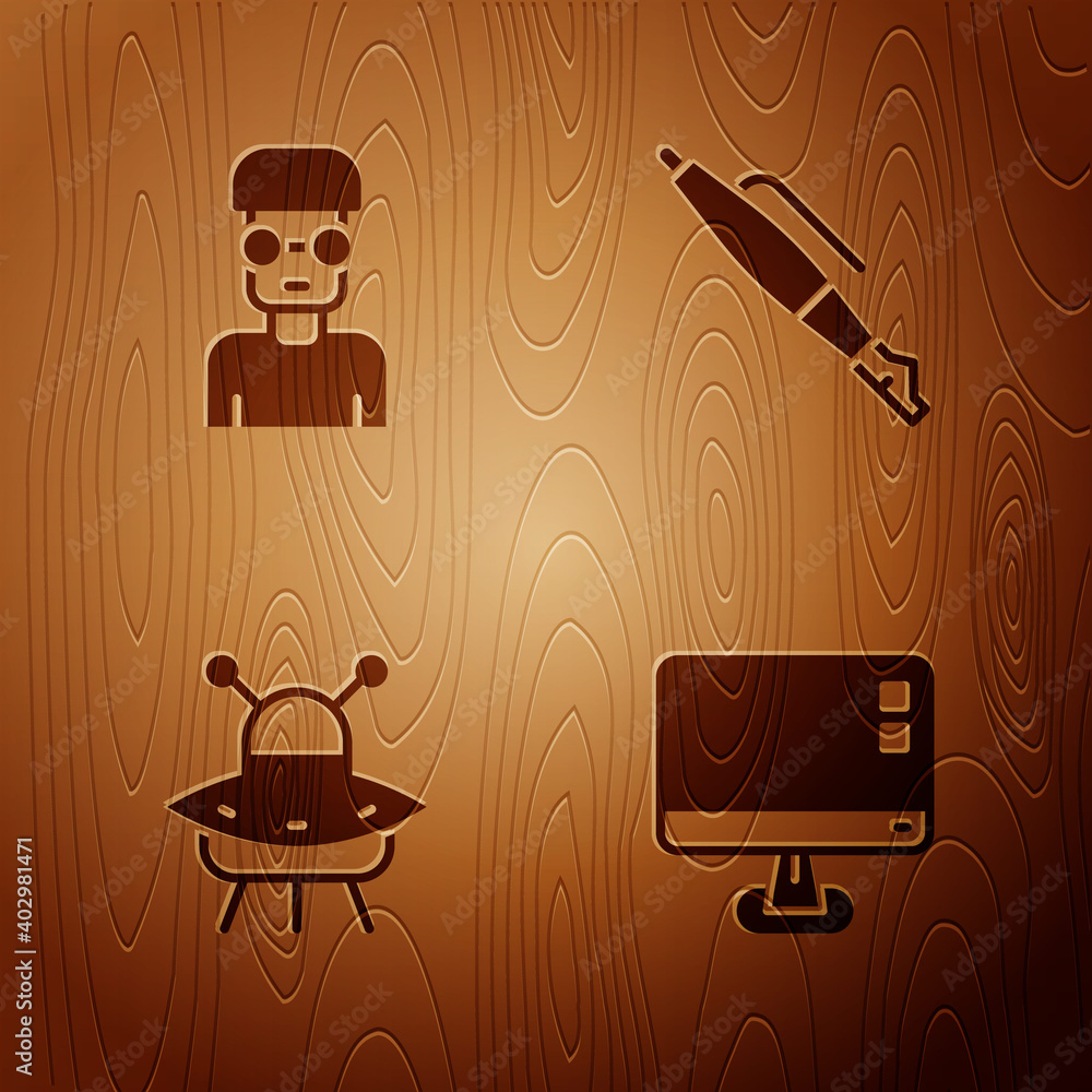 Poster set computer monitor screen, nerd geek, ufo flying spaceship and fountain pen nib on wooden backgrou