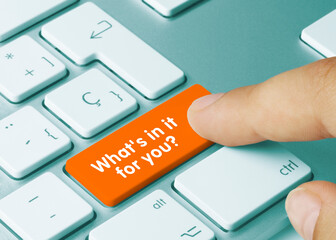 What's in it for you? - Inscription on Orange Keyboard Key.