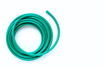 Green garden hose on white background.