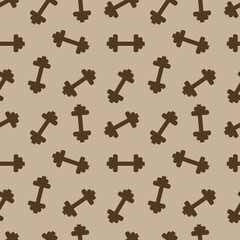 Dumbbells for sports on a brown background.