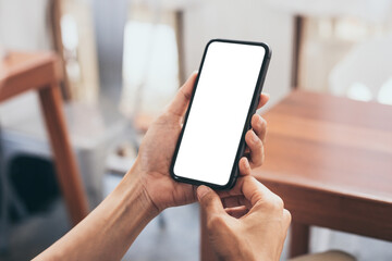 cell phone blank white screen mockup.woman hand holding texting using mobile on desk at office.background empty space for advertise.work people contact marketing business,technology