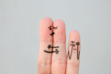 Fingers art of happy family. Concept of couple kisses,  child spies on them.