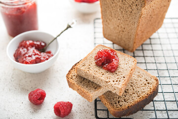 Black homemade bread with jam, selective focus