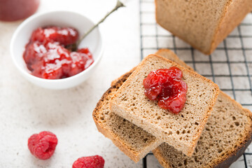 Black homemade bread with jam, selective focus