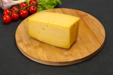 Hard yellow tasty cheese brick