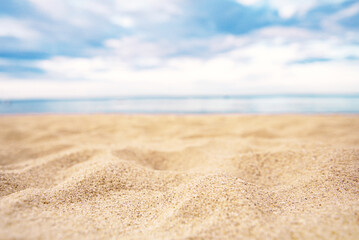 Fototapeta na wymiar Tropical summer sand beach and bokeh sun light on sea background, copy space.