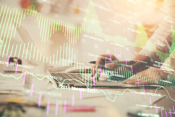 Multi exposure of woman hands typing on computer and financial chart hologram drawing. Stock market analysis concept.