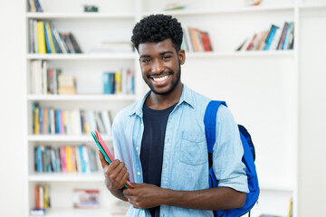 Laughing young african american male student with beard