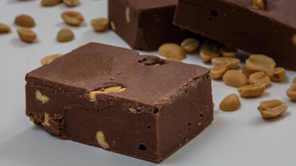 Homemade chocolate with nuts on white background