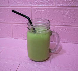 a glass of avocado juice