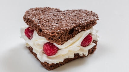 Cake pieces with cream, fruits, and chocolate