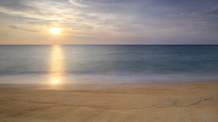 Fototapeta na wymiar beautiful sunset on MAI KHAO beach in Phuket, Thailand