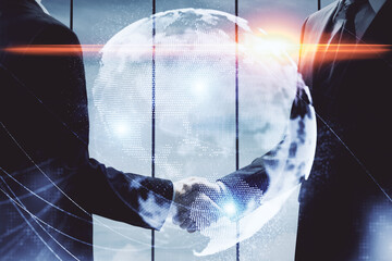 Double exposure of business theme hologram and handshake of two men. Success concept.