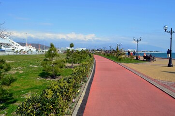 Embankment of a seaside resort town overlooking the sea and mountains