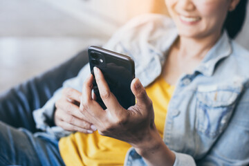 woman work using cell phone hand holding mobile texting message contact us.chatting,search internet...