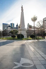 Foto op Canvas Plaza de Mayo square in Buenos Aires, Argentina. It is believed to be the foundational site of the city. The May pyramid is lit by sunrays, mothers of plaza de mayo's symbol on the ground © anna pozzi