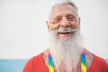 Senior hipster gay man smiling on camera - Focus on face