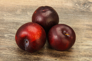 Ripe sweet plum fruit heap