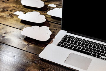 Cloud computing concept with laptop on an angle