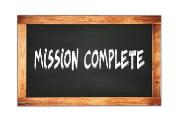 MISSION  COMPLETE text written on wooden frame school blackboard.