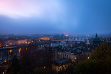 Prague with the bridges over the Vltava river during the moody morning. Czech Republic capital waking up.