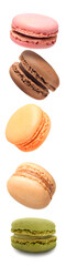 Macaroons assorted are falling down isolated on white. Beautiful artistic food background.