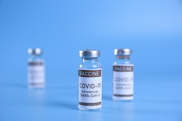Coronavirus vaccine - The medical concept. Ampoule with Covid-19, SARS-Cov-2 vaccine. Copyspace. Vaccination, immunization, treatment to cure Covid 19 Corona Virus infection Concept
