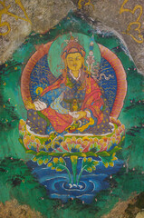 Obraz premium Colorful rock painting of Padmasambhava or Guru Rinpoche on a rock on the path to Paro Taktsang aka Tiger's Nest monastery in Bhutan