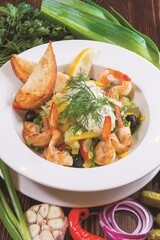 Seafood Caesar salad with shrimp, arugula, and parmesan cheese on a round white plate. Restaurant serving concept. Close-up.