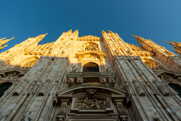 Close up of Milan's cathedral hit by sunrays during sunset
