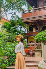 Obraz premium Happy asian woman walking outdoors in Buu Long Pagoda in Ho Chi Minh City. A beautiful buddhist temple hidden away in Ho Chi Minh City at Vietnam